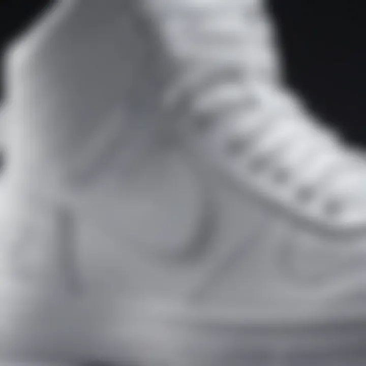 A close-up view of the detailing and texture of Nike high tops in pristine white.