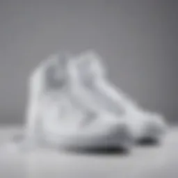 Stylish all white Nike high tops elegantly displayed on a minimalist background.