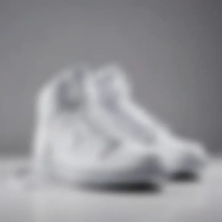 Stylish all white Nike high tops elegantly displayed on a minimalist background.
