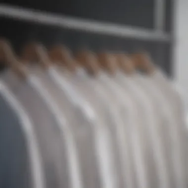 Variety of white undershirts displayed on a hanger