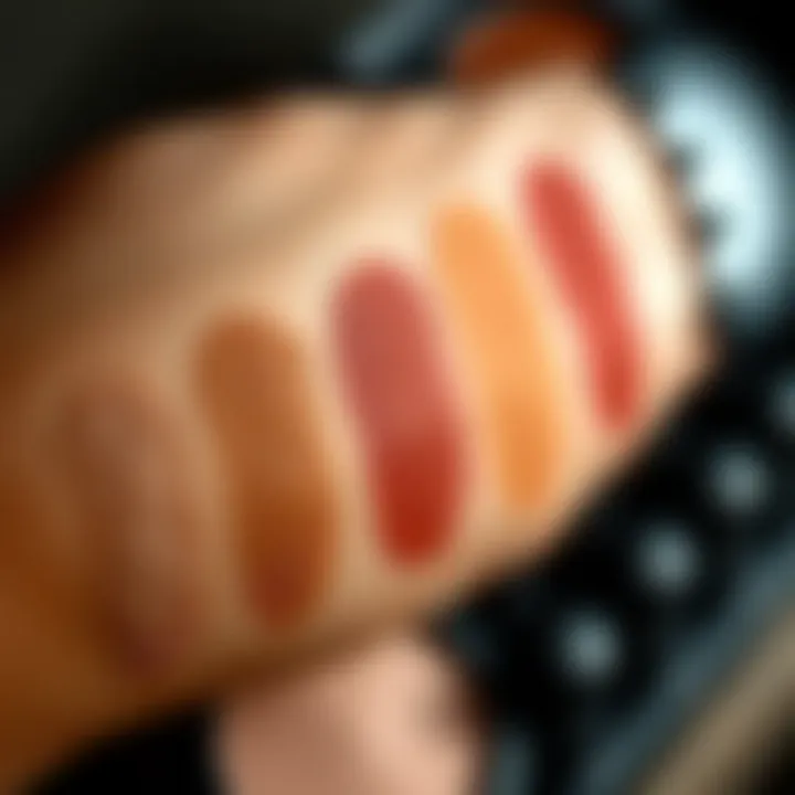 Swatches Demonstrating MAC Formulations on Varied Skin Tones Close-up of MAC eyeshadow swatches on different skin tones