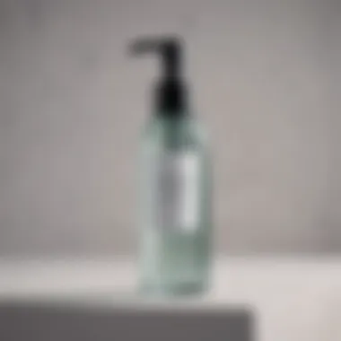 A sleek bottle of gel cleanser with a pump dispenser against a minimalist backdrop.