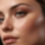 Close-up of a woman applying foundation on her T-zone