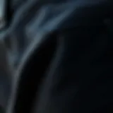 Close-up of J Crew black jeans showcasing premium fabric texture