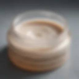 Close-up view of a kojic acid bleaching cream jar showcasing its texture.
