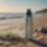 A close-up view of sea mist hair spray bottle on a beach background