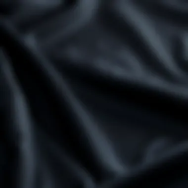 Close-Up of Luxurious Black Silk Fabric Close-up of luxurious black silk fabric showcasing its smooth texture