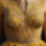 Close-up of the intricate fabric pattern of the yellow open waist dress.