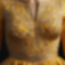 Close-up of the intricate fabric pattern of the yellow open waist dress.