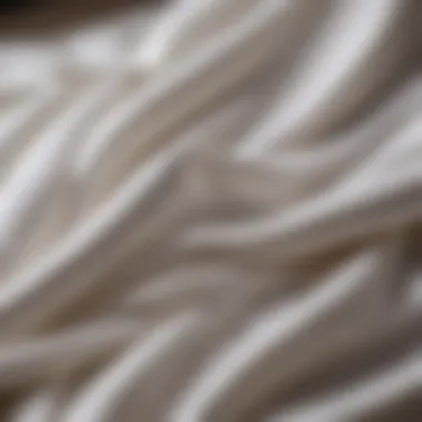 Close-up of white silk fabric showcasing its luxurious texture