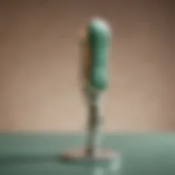 Close-up of a jade face roller on a luxurious silk background