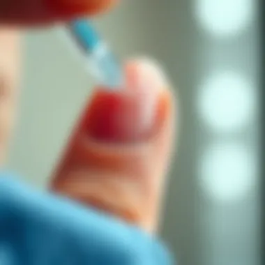 A close-up of a nail being treated with a transparent hardener, emphasizing the glossy finish