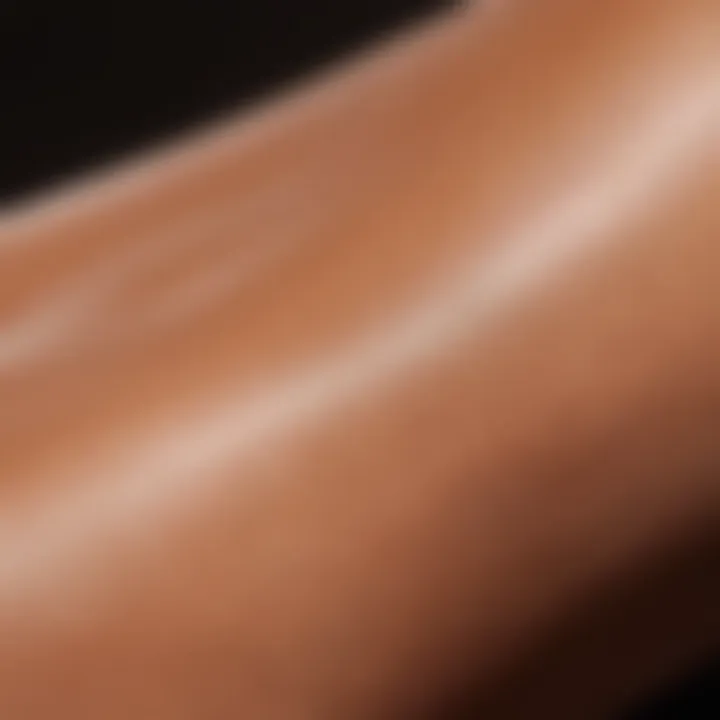 Close-up of skin being applied with a tanning product