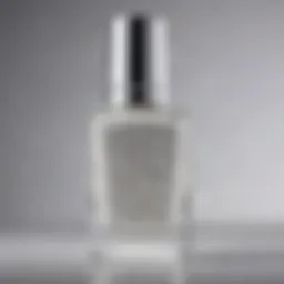 A close-up of sparkling white glitter nail polish in a chic bottle